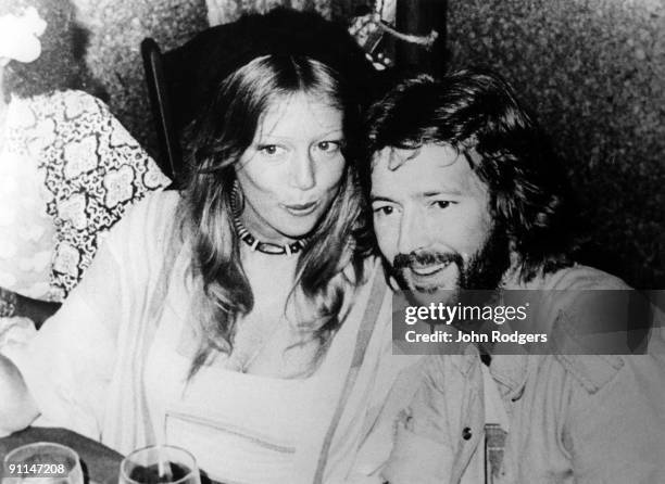 Photo of Patti BOYD and Eric CLAPTON, Patti Boyd & Eric Clapton posed at a party at the Cherokee Studios