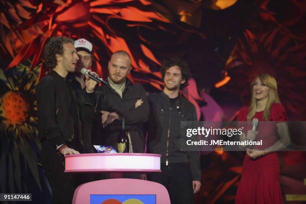 Photo of COLDPLAY, L-R. Chris Martin, Jonny Buckland, Will Champion, Guy Berryman with Madonna