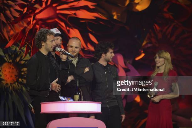 Photo of Will CHAMPION and Guy BERRYMAN and COLDPLAY and Chris MARTIN and MADONNA and Jonny BUCKLAND, L-R. Chris Martin, Jonny Buckland, Will...