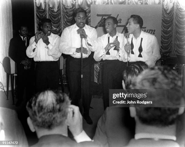 Photo of MIRACLES, Group performing on stage L-R Pete Moore, Bobby Rogers, Ronald White and Smokey Robinson