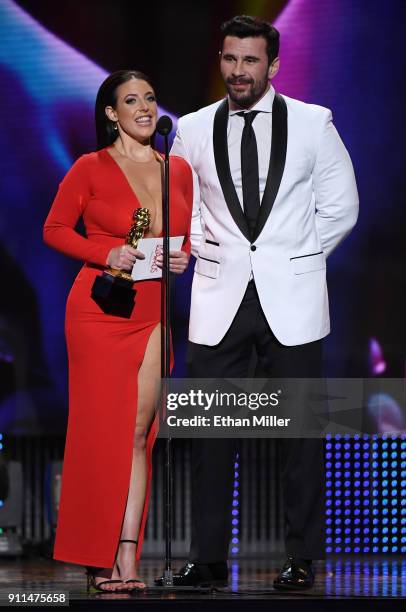 Adult film actress/director and co-host Angela White and adult film actor/director Manuel Ferrara accept the award for Best Boy/Girl Sex Scene during...