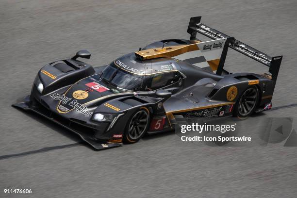 The Mustang Sampling Racing Cadillac DPi-V.R. Of Filipe Albuquerque, Joao Barbosa and Christian Fittipaldi races during the Rolex 24 at Daytona on...