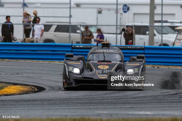 The Mustang Sampling Racing Cadillac DPi-V.R. Of Filipe Albuquerque, Joao Barbosa and Christian Fittipaldi races during the Rolex 24 at Daytona on...