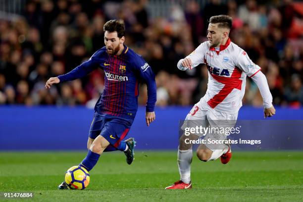 Lionel Messi of FC Barcelona, Alvaro Medran of Deportivo Alaves during the La Liga Santander match between FC Barcelona v Deportivo Alaves at the...