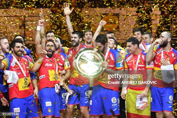 Spain's Raul Entrerrios kisses the EHF European Handball Championship trophy as Spain's players celebrate during the podium ceremony, after winning...
