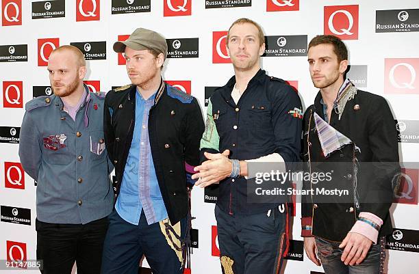 Photo of COLDPLAY and Will CHAMPION and Jonny BUCKLAND and Chris MARTIN and Guy BERRYMAN, Group portrait of Coldplay arriving at the Grosvenor House...