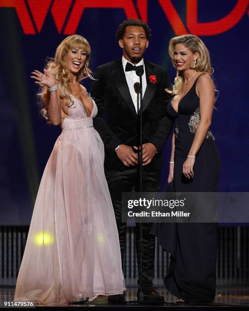 Adult film actress Cherie DeVille, adult film actor Ricky Johnson and adult film actress Jessa Rhodes present an award during the 2018 Adult Video...