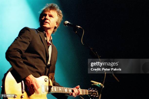 Photo of Neil FINN and CROWDED HOUSE; Neil Finn performing on stage at the Carre Theatre, Amsterdam