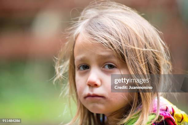 sad little girl - sad kid in kindergarten stock pictures, royalty-free photos & images
