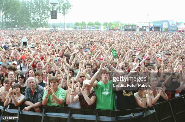 3rd JULY: Photo of FESTIVALS; Werchterrock, Werchter, Belgium on 3rd July 2005. Crowds and audience members wave their arms in the air at...