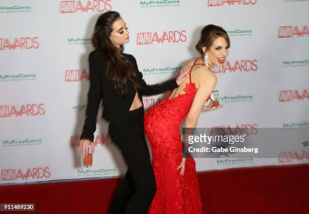 Adult film actresses Gia Paige and Kimmy Granger joke around during the 2018 Adult Video News Awards at the Hard Rock Hotel & Casino on January 27,...