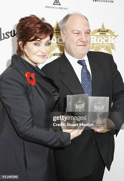 Photo of Harvey GOLDSMITH and Sharon OSBOURNE, Sharon Osbourne and Harvey Goldsmith with his Armand de Brignac VIP Award at the Classic Rock Roll of...