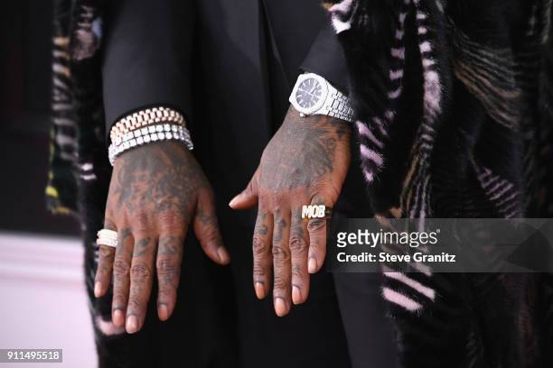 Recording artist Rick Ross, jewelry detail, attends the 60th Annual GRAMMY Awards at Madison Square Garden on January 28, 2018 in New York City.