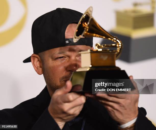 Recording artist Residente, winner of the Best Latin Rock, Urban or Alternative Album award for 'Residente,' poses in the press room during the 60th...