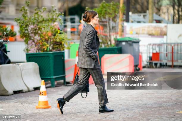 Guest wears a checked pattern suit and blazer, outside Chanel, during Paris Fashion Week -Haute Couture Spring/Summer 2018, on January 23, 2018 in...