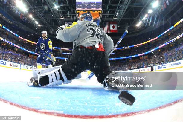 Nikita Kucherov of the Tampa Bay Lightning gets a goal past Henrik Lundqvist of the New York Rangers in the second half during the 2018 Honda NHL...
