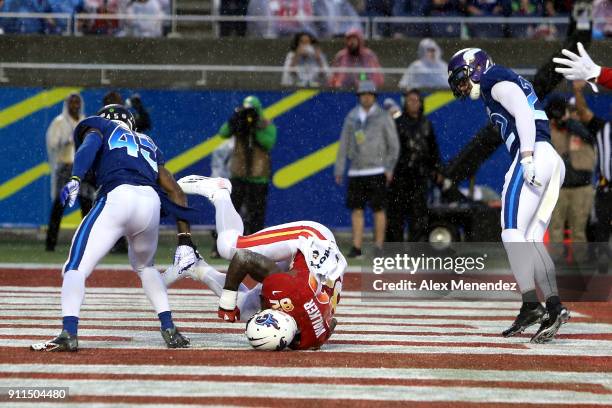 Delanie Walker of the Tennessee Titans scores a touchdown in front of Deion Jones of the Atlanta Falcons during the NFL Pro Bowl between the AFC and...