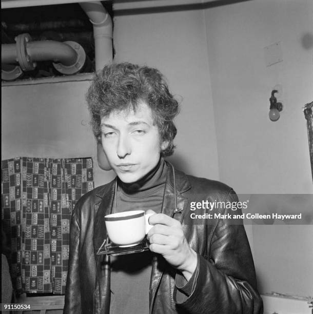 Photo of Bob DYLAN, backstage at his famous Free Trade Hall Concert, drinking cup of tea