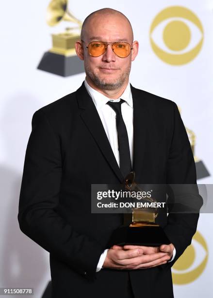 Scott Devendorf of The National, winner of Best Alternative Music Album for 'Sleep Well Beast,' poses in the press room during the 60th Annual Grammy...