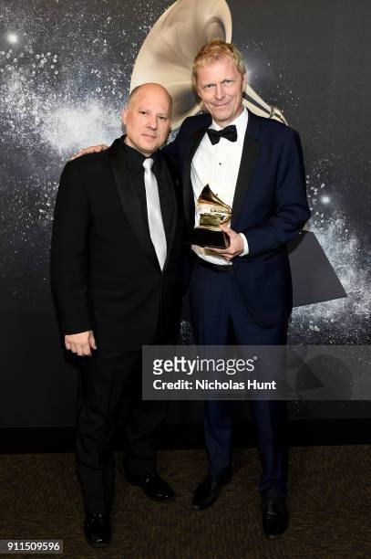 Chair of the Board for The Recording Academy John Poppo and Music producer Marius de Vries, with his award for the Best Compilation Soundtrack, poses...