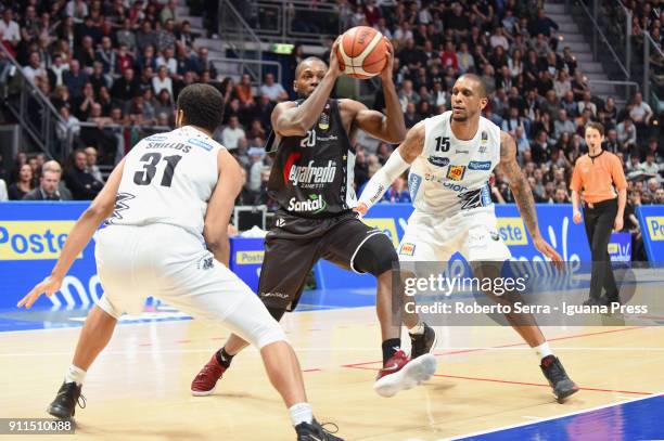 Oliver Lafayette of Segafredo competes with Shavon Shields and Joao Gomes of Dolomiti Energia during the LBA Lega Basket of Serie A match between...