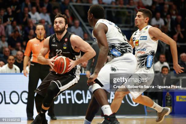 Stefano Gentile of Segafredo competes with Dustin Hogue and Diego Flaccadori of Dolomiti Energia during the LBA Lega Basket of Serie A match between...