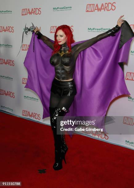 Adult film actress ShandaFay body painted to look like the character Batgirl from the "Batman" comic book franchise attends the 2018 Adult Video News...