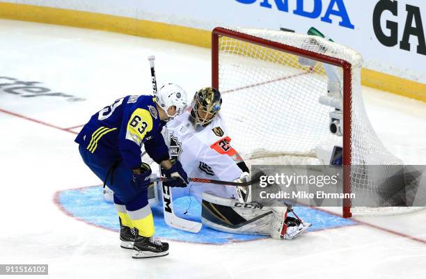 Marc-Andre Fleury of the Vegas Golden Knights blocks a goal by Brad Marchand of the Boston Bruins in the first half during the 2018 Honda NHL...