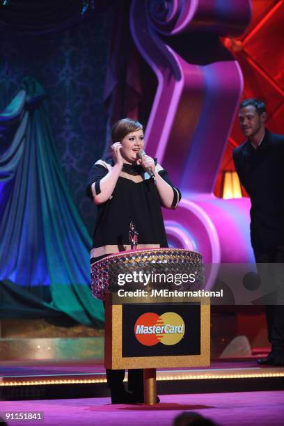 Photo of Adele, Adele on stage accepting the Critics' Choice Award