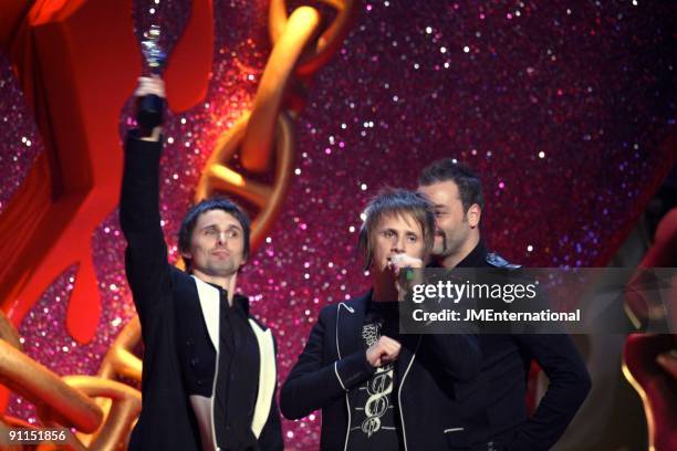 Photo of Chris WOLSTENHOLME and Dominic HOWARD and Matt BELLAMY and MUSE, L-R: Matt Bellamy, Dominic Howard, Chris Wolstenholme collecting the award...