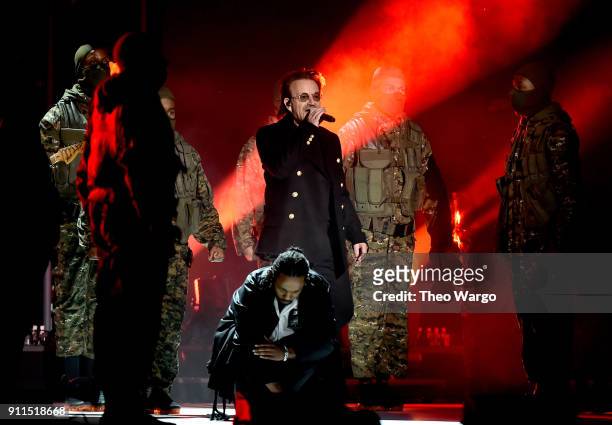 Recording artists Bono of musical group U2 and Kendrick Lamar perform onstage during the 60th Annual GRAMMY Awards at Madison Square Garden on...