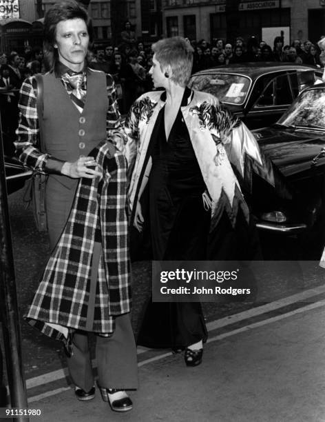 Photo of Angie BOWIE and David BOWIE; David and Angie Bowie arrive at the Empire, Leicester Square for the premier of 'Hitler's last ten days'
