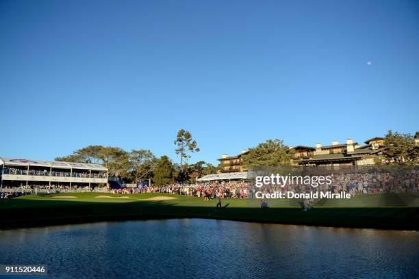 Ryan Palmer, Jason Day of Australia and Alex Noren of Sweden walk up the fairway during the first playoff on the 18th hole during the final round of...