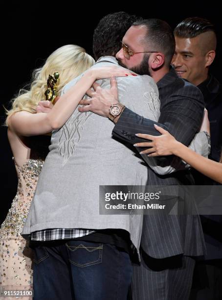 Adult film director/producer Kevin Moore is hugged after speaking about his late wife, adult film actress August Ames, during the 2018 Adult Video...