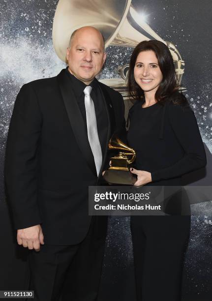 Chair of the Board for The Recording Academy John Poppo and producer Jamie Rabineau, winner of Best Music Video, pose backstage at the Premiere...