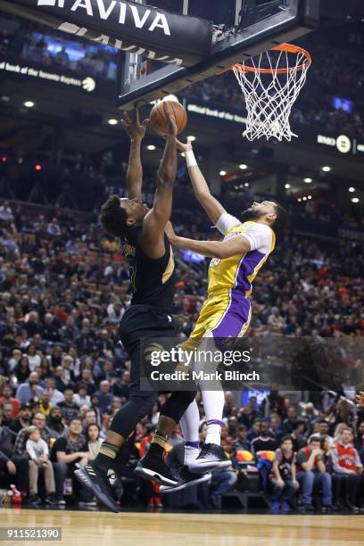 Kyle Lowry of the Toronto Raptors blocks the shot against Tyler Ennis of the Los Angeles Lakers on January 28, 2018 at the Air Canada Centre in...