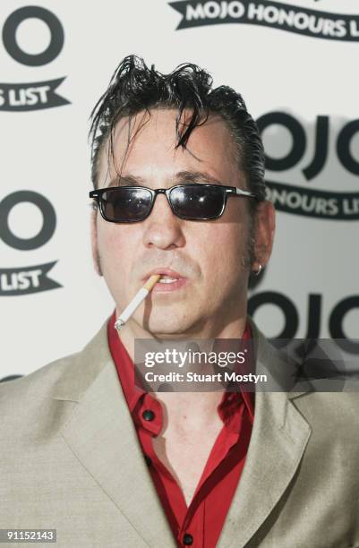 Photo of Richard HAWLEY, posed, arriving at awards, smoking cigarette, wearing sunglasses