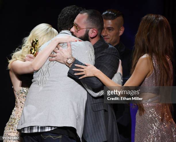 Adult film director/producer Kevin Moore is hugged after speaking about his late wife, adult film actress August Ames, during the 2018 Adult Video...