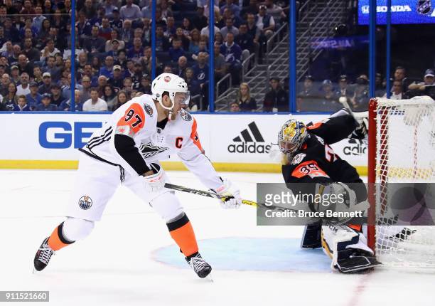 Connor McDavid of the Edmonton Oilers shoots a goal against Pekka Rinne of the Nashville Predators during the 2018 Honda NHL All-Star Game between...