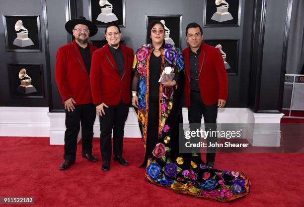Musicians Alex Bendana, Jose Carlos, Gloria Estrada, and Miguel Ramirez of band La Santa Cecilia attend the 60th Annual GRAMMY Awards at Madison...