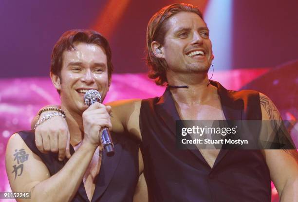 Photo of BOYZONE and Stephen GATELY and Keith DUFFY, Stephen Gately and Keith Duffy performing on stage