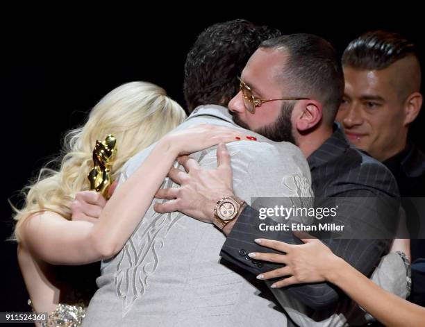 Adult film director/producer Kevin Moore is hugged after speaking about his late wife, adult film actress August Ames, during the 2018 Adult Video...