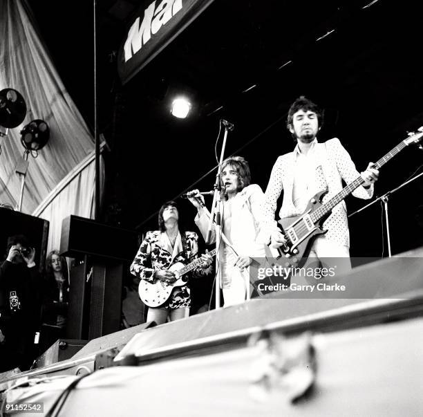 Photo of FACES and Rod STEWART and Ron WOOD and Ronnie WOOD and Ronnie LANE, L-R: Ron Wood , Rod Stewart, Ronnie Lane - performing live onstage