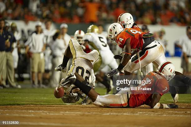 Georgia Tech Roddy Jones in action vs Miami Eric Moncur and Vaughn Telemaque . Miami, FL 9/17/2009 CREDIT: Bill Frakes