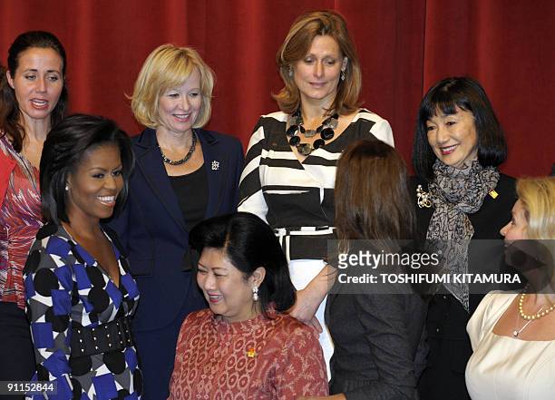 Miyuki Hatoyama, the wife of Japanese Prime Minister Yukio Hatoyama smiles in a photo session with other wives include US First Lady Michelle Obama...