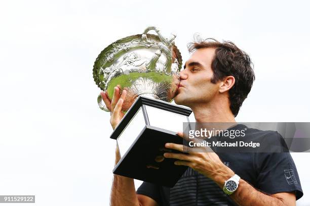 Roger Federer of Switzerland kisses the Norman Brookes Challenge Cup after winning the 2018 Australian Open Men's Singles Final, at Government House...