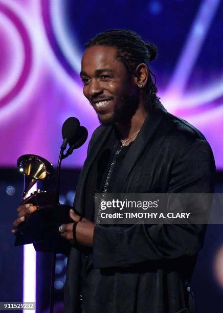 Kendrick Lamar receives the Grammy for the Best Rap Album with DAMN. During the 60th Annual Grammy Awards show on January 28 in New York. / AFP PHOTO...