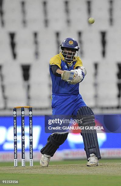 Sri Lanka batsman Muthiah Muralidran hits a six on September 25, 2009 during the ICC Champions Trophy group match between England and Sri Lanka at...