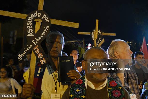 Members of the National Convergence Against Continuity movement in Honduras and church people from the United States take part in a vigil outside the...