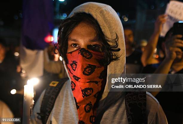 Members of the National Convergence Against Continuity movement in Honduras and church people from the United States take part in a vigil outside the...